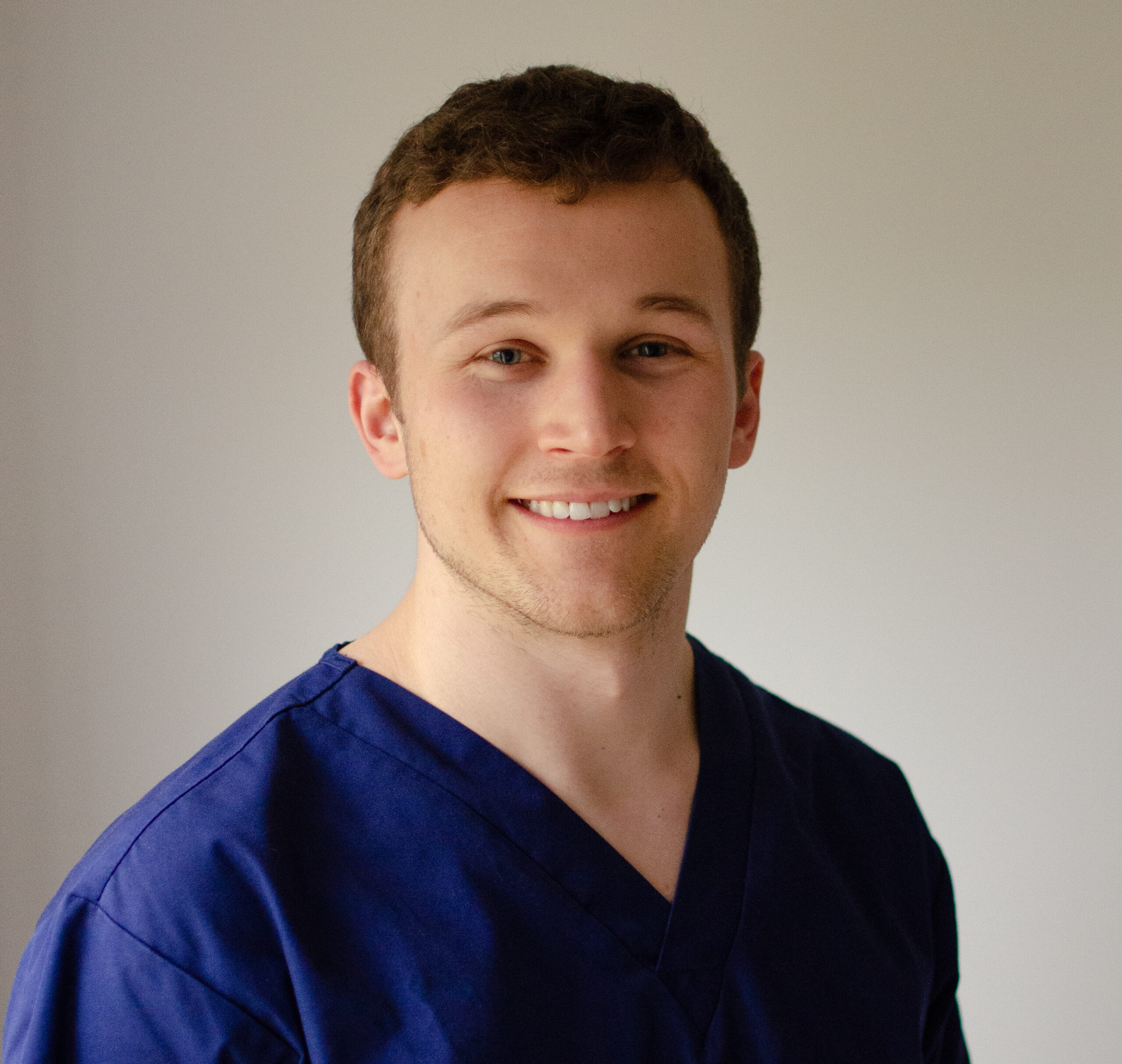 Portrait of John, lead dentist at Kids Dental Care, smiling