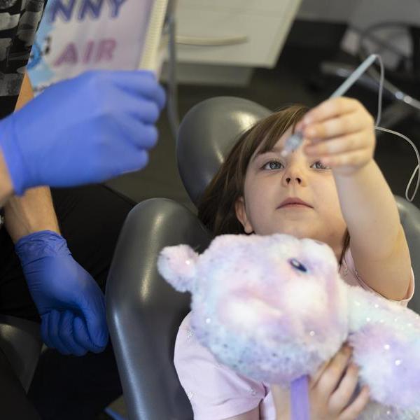 Child holding Wand anaesthetic